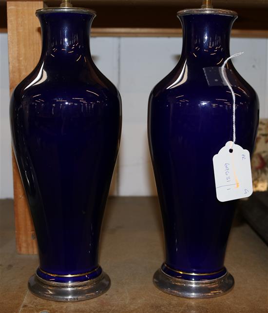 Pair of Sevres Manufacture de lEtat bleu-de-roi vases with plain silver mounts, London 1920 (lamp fittings, one hairline)